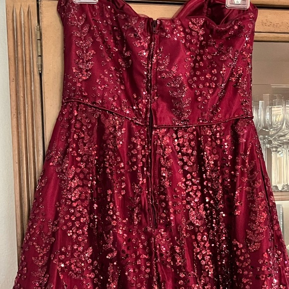 Beautiful strapless burgundy embellished gown. - Picture 5 of 6